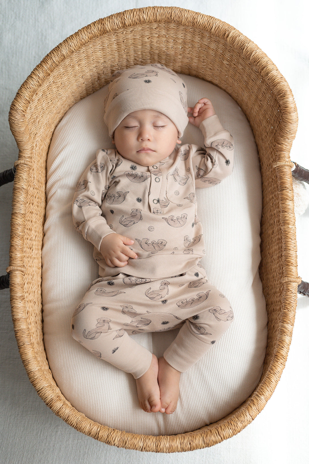 Child wearing Reversible Organic Beanie in Sea Otter.