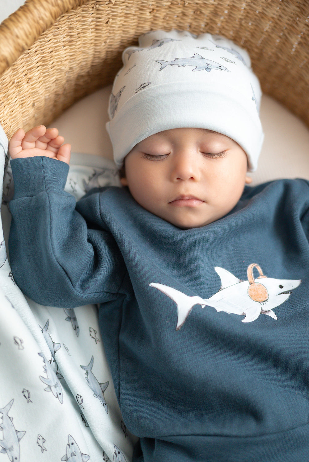 Child wearing Reversible Organic Beanie in Sharks.