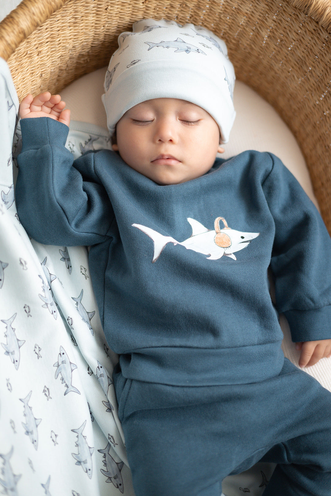 Child wearing Reversible Organic Beanie in Sharks.