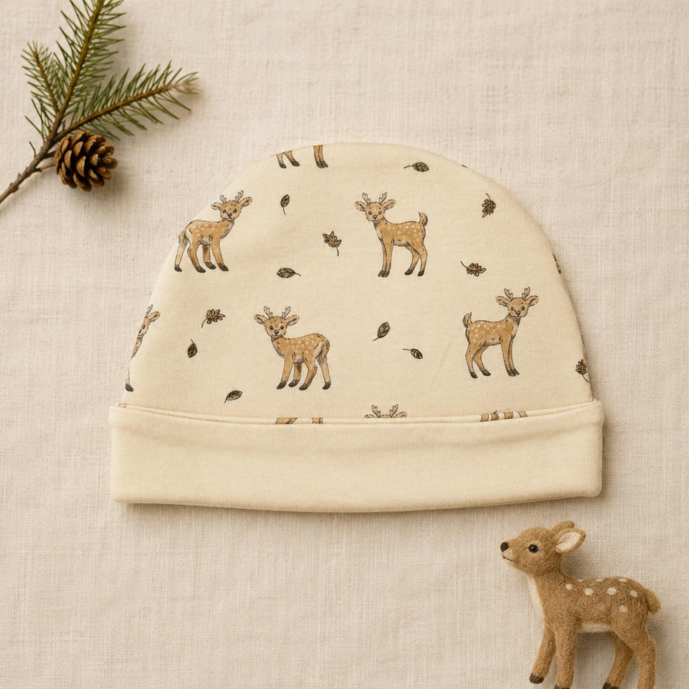 Child wearing Reversible Organic Beanie in White Tail Deer.