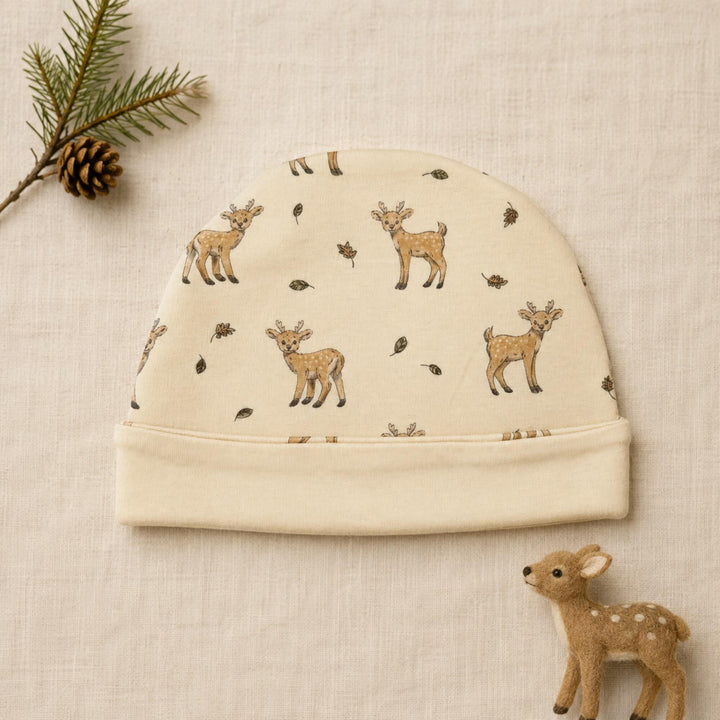 Child wearing Reversible Organic Beanie in White Tail Deer.