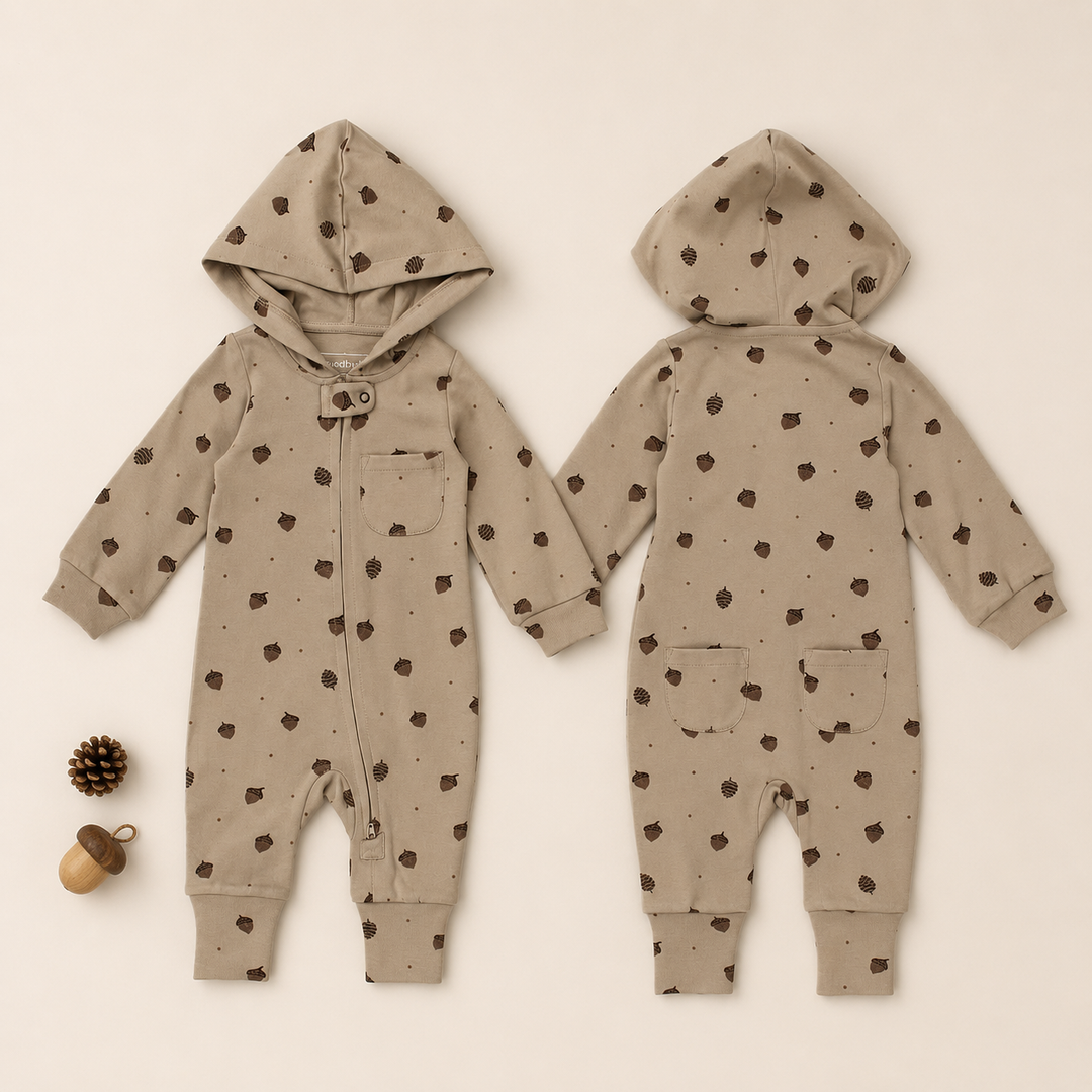 Styled flatlay of Organic Hooded Zipper Romper in Little Acorn