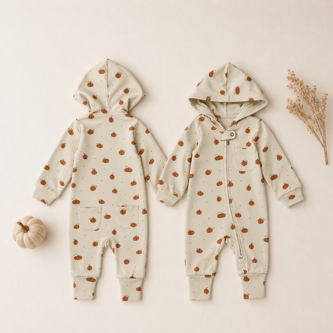 Styled flatlay of Organic Hooded Zipper Romper in Pumpkin Spice.