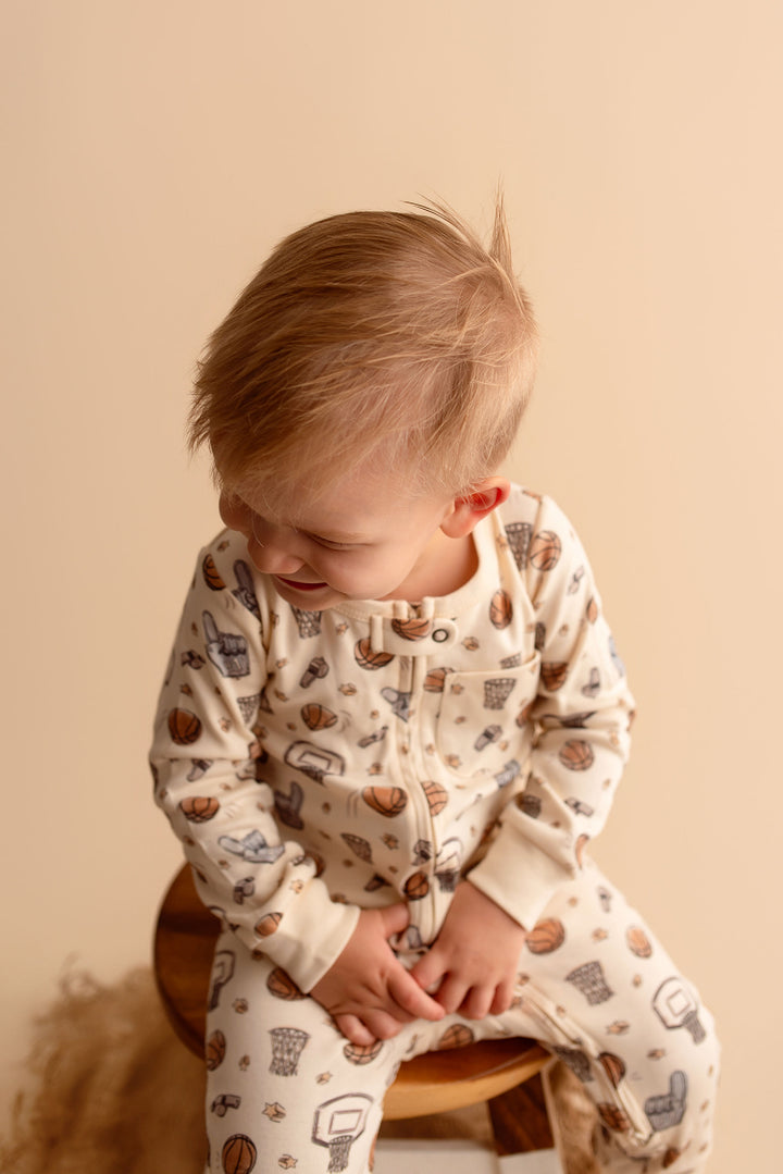 Child wearing Organic Footless 2-Way Zipper Romper in Hoops.