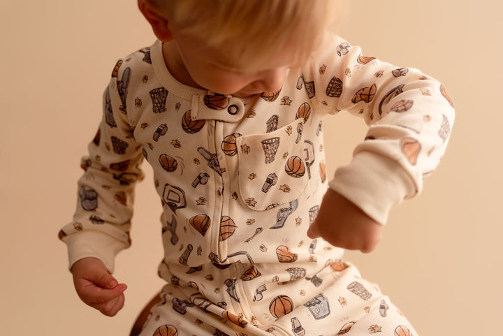 Child wearing Organic Footless 2-Way Zipper Romper in Hoops.