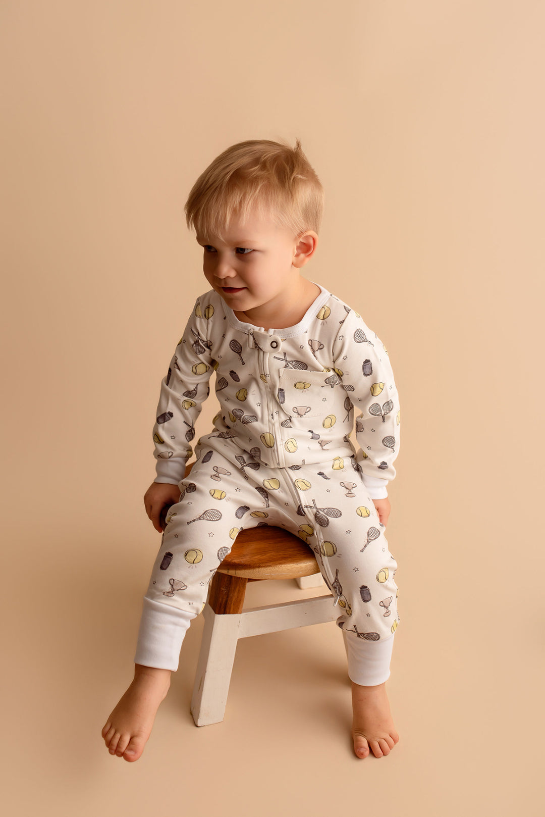 Child wearing Organic Footless 2-Way Zipper Romper in Little Ace.