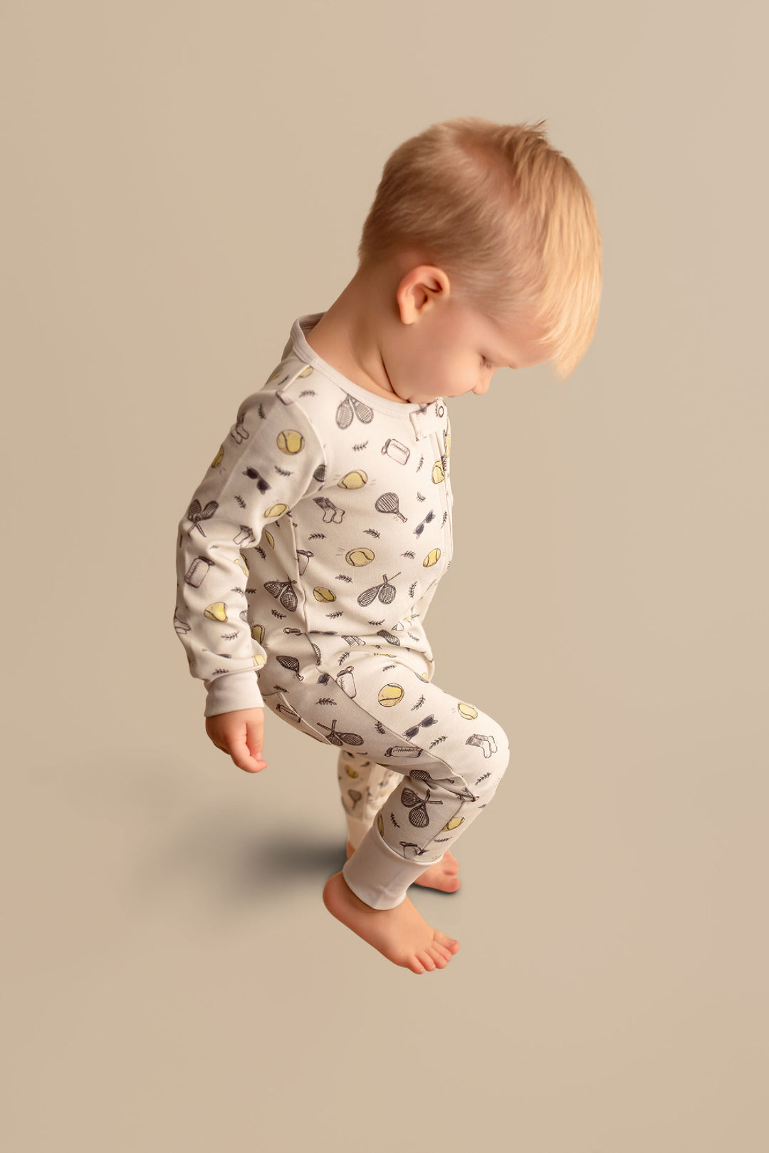 Child wearing Organic Footless 2-Way Zipper Romper in Little Ace.