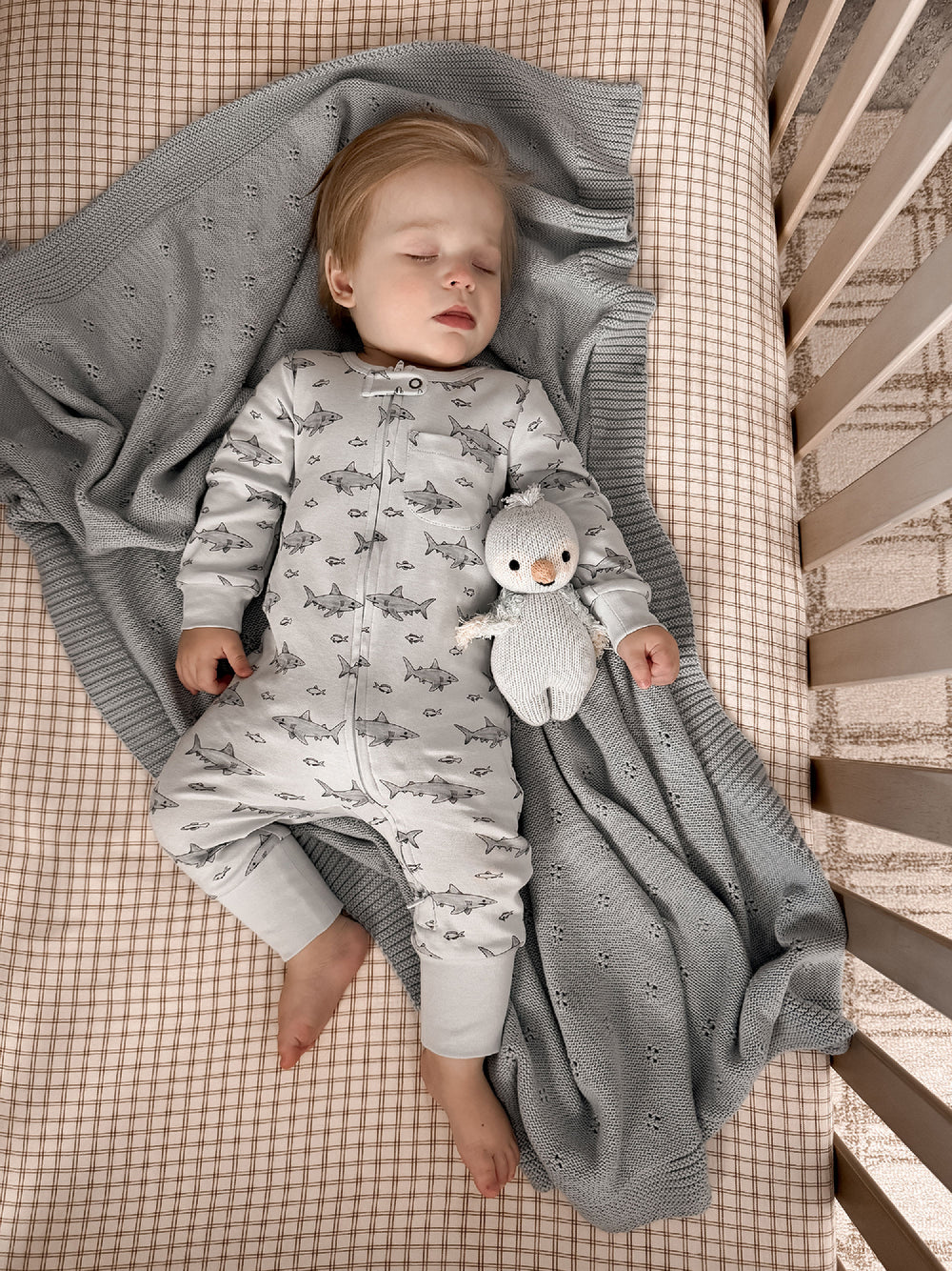Child wearing Organic Footless 2-Way Zipper Romper in Sharks.