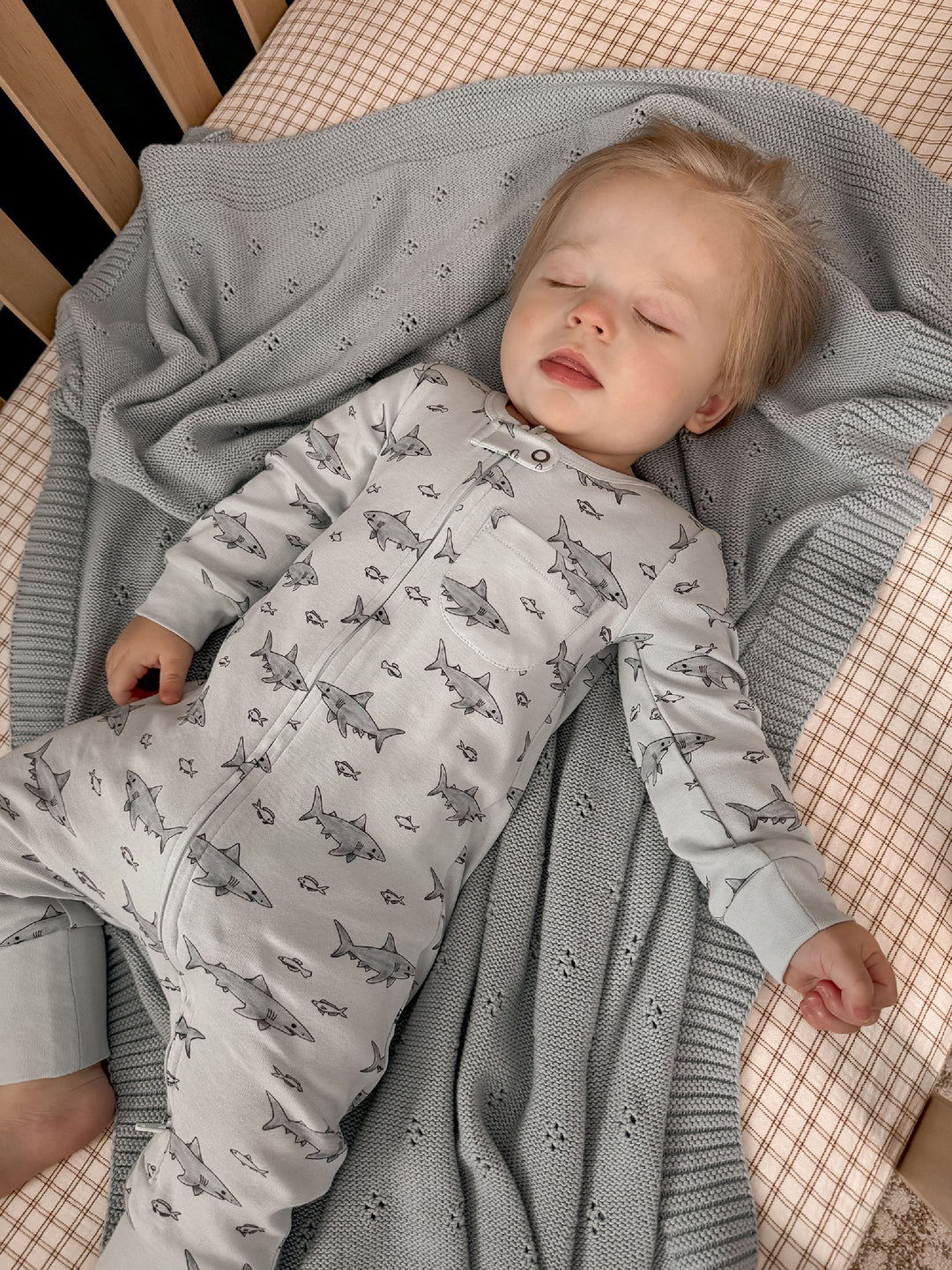 Child wearing Organic Footless 2-Way Zipper Romper in Sharks.