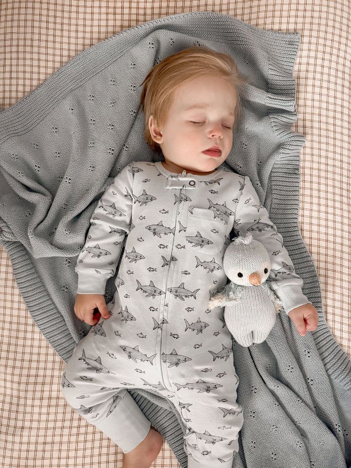 Child wearing Organic Footless 2-Way Zipper Romper in Sharks.