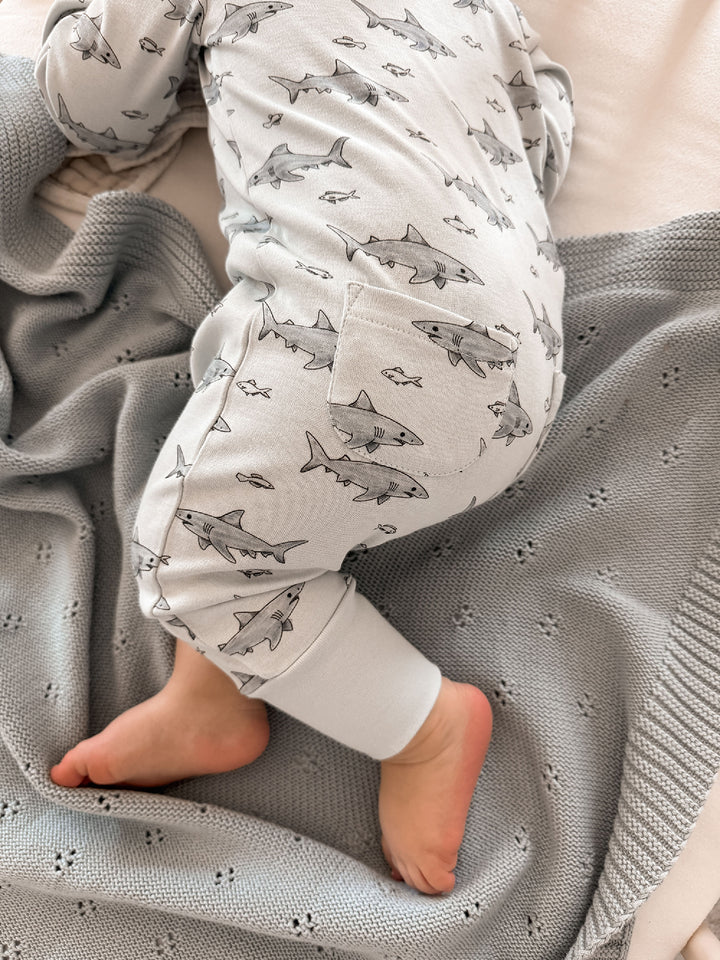 Child wearing Organic Footless 2-Way Zipper Romper in Sharks.