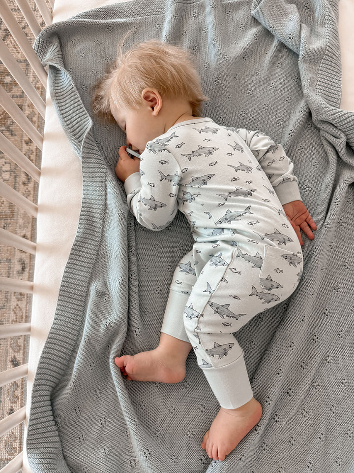 Child wearing Organic Footless 2-Way Zipper Romper in Sharks.