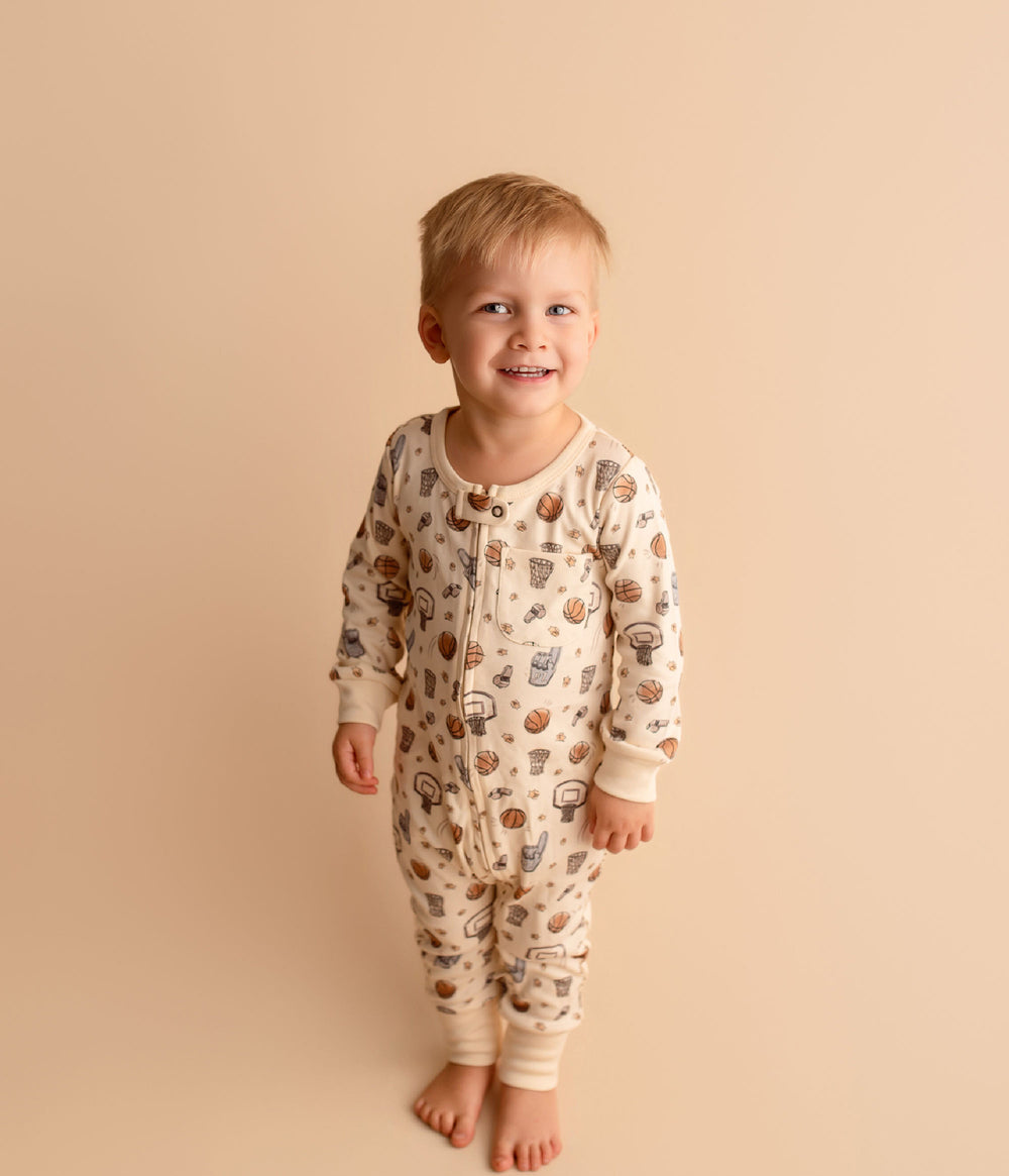 Child wearing Organic Footless 2-Way Zipper Romper in Touchdown.