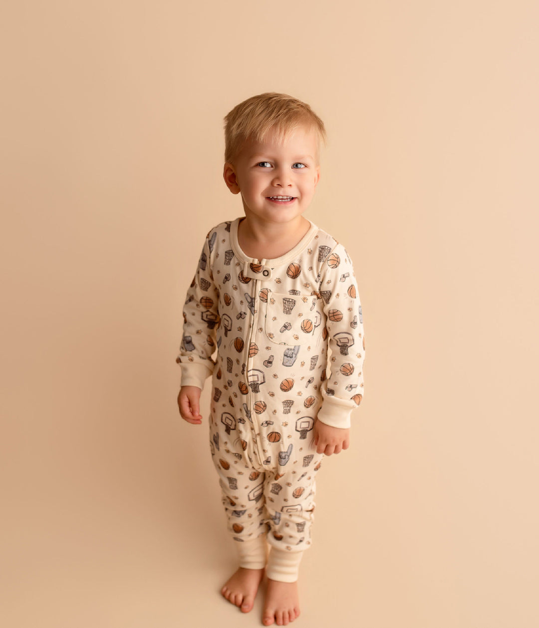 Child wearing Organic Footless 2-Way Zipper Romper in Touchdown.