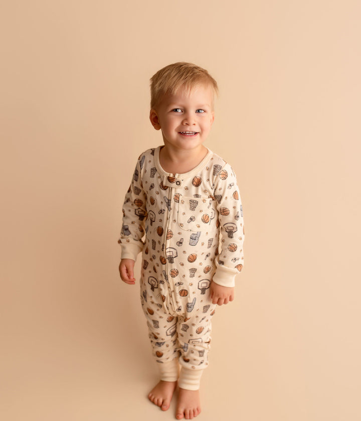 Child wearing Organic Footless 2-Way Zipper Romper in Touchdown.