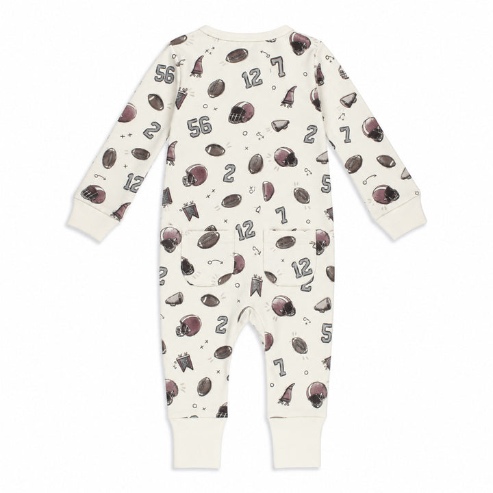 Styled flatlay of Organic Footless 2-Way Zipper Romper in Touchdown.
