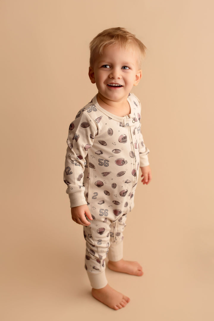 Child wearing Organic Footless 2-Way Zipper Romper in Touchdown.