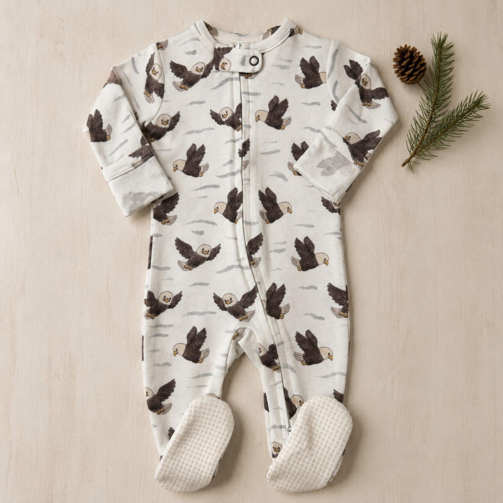 Child wearing Organic 2-Way Zipper Footie in Bald Eagle.