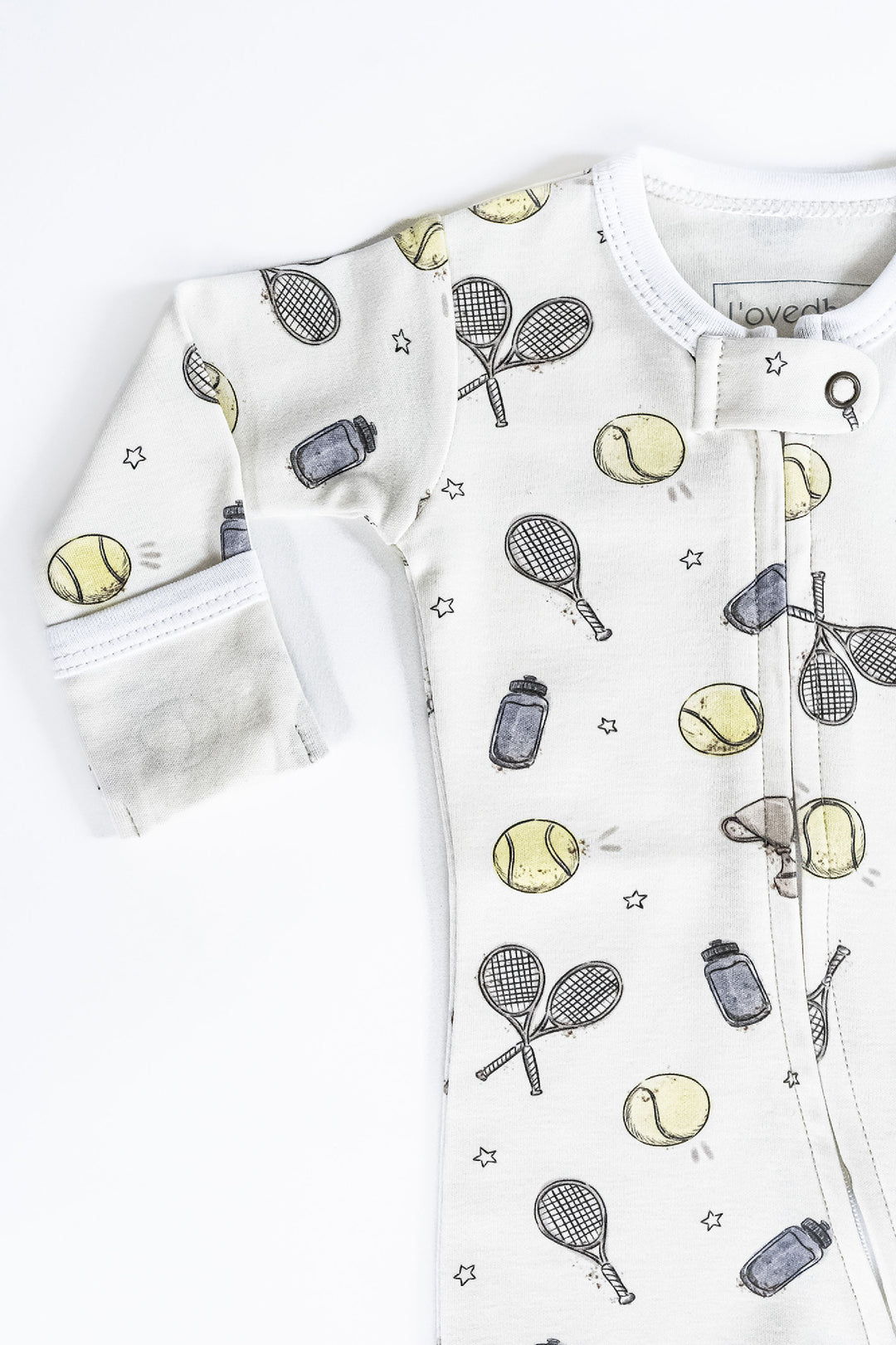 Child wearing Organic 2-Way Zipper Footie in Little Ace.