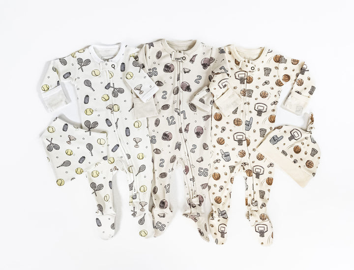 Child wearing Organic 2-Way Zipper Footie in Little Ace.
