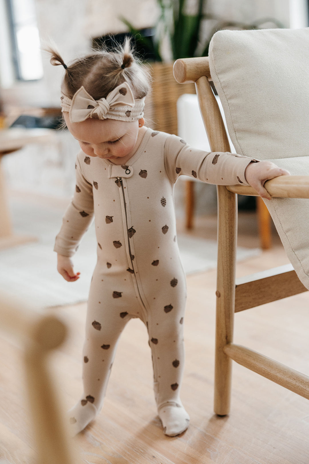 Child wearing Organic 2-Way Zipper Footie in Little Acorn.