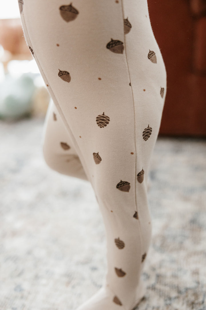 Child wearing Organic 2-Way Zipper Footie in Little Acorn.
