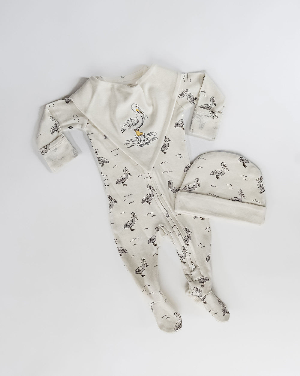 Child wearing Organic 2-Way Zipper Footie in Pelican.