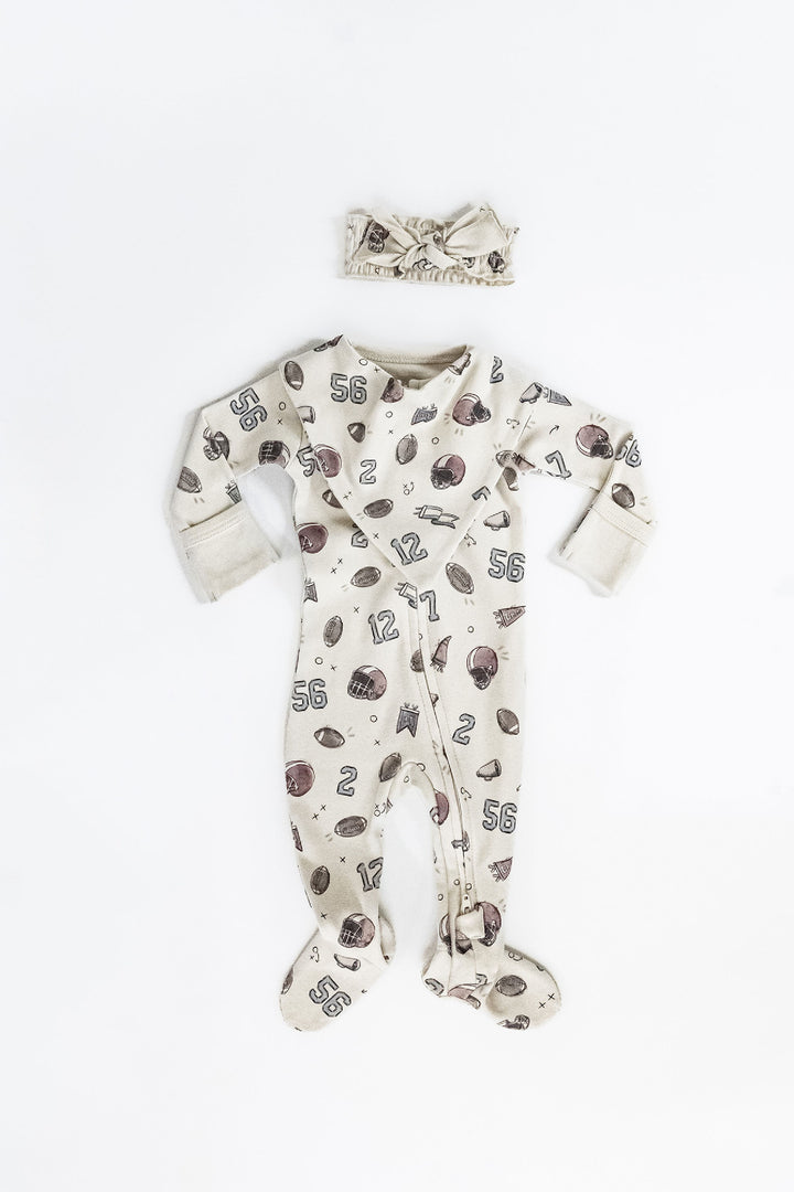 Child wearing Organic 2-Way Zipper Footie in Touchdown.