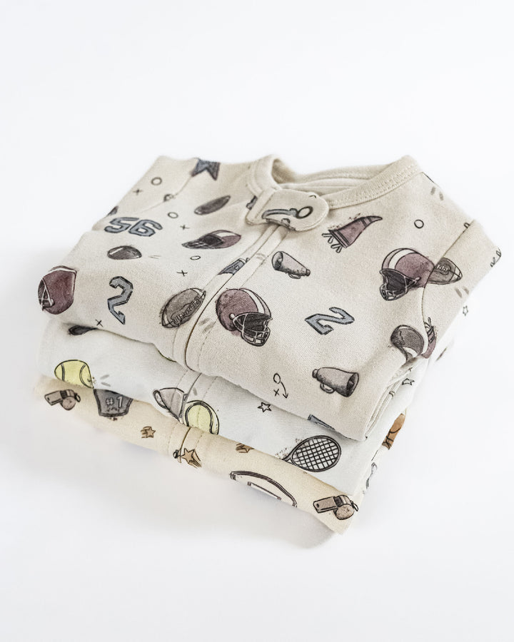 Child wearing Organic 2-Way Zipper Footie in Touchdown.