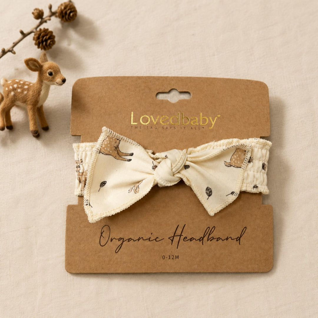 Child wearing Organic Smocked Tie Headband in White Tail Deer.