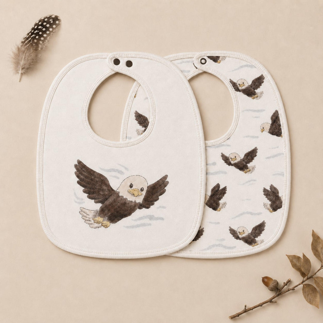 Child wearing Organic Reversible Bib in Bald Eagle.