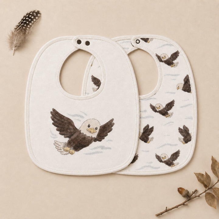 Child wearing Organic Reversible Bib in Bald Eagle.