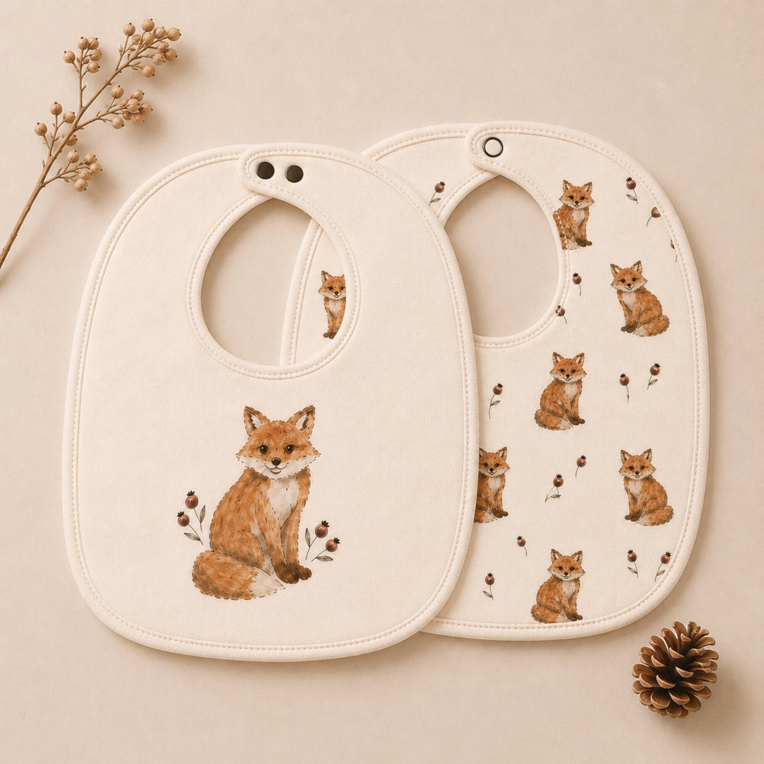 Child wearing Organic Reversible Bib in Red Fox.