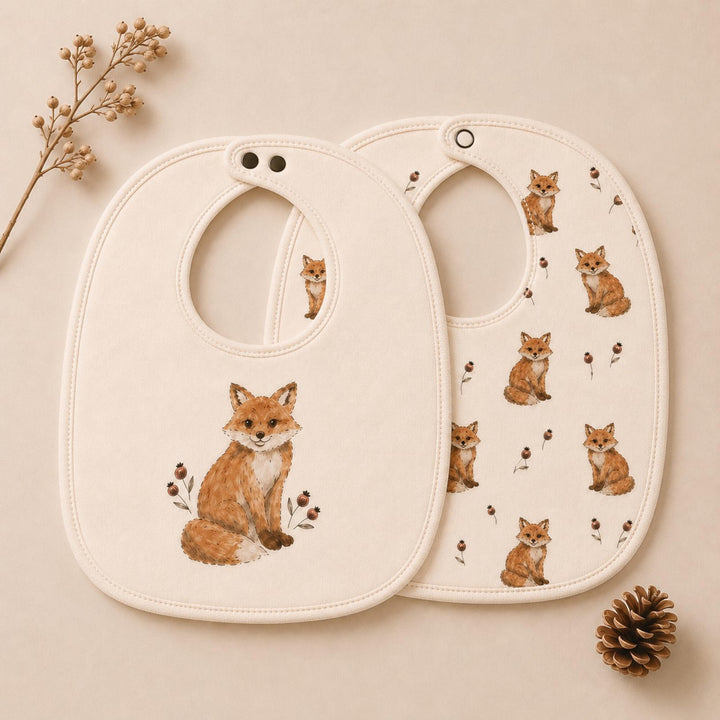 Child wearing Organic Reversible Bib in Red Fox.