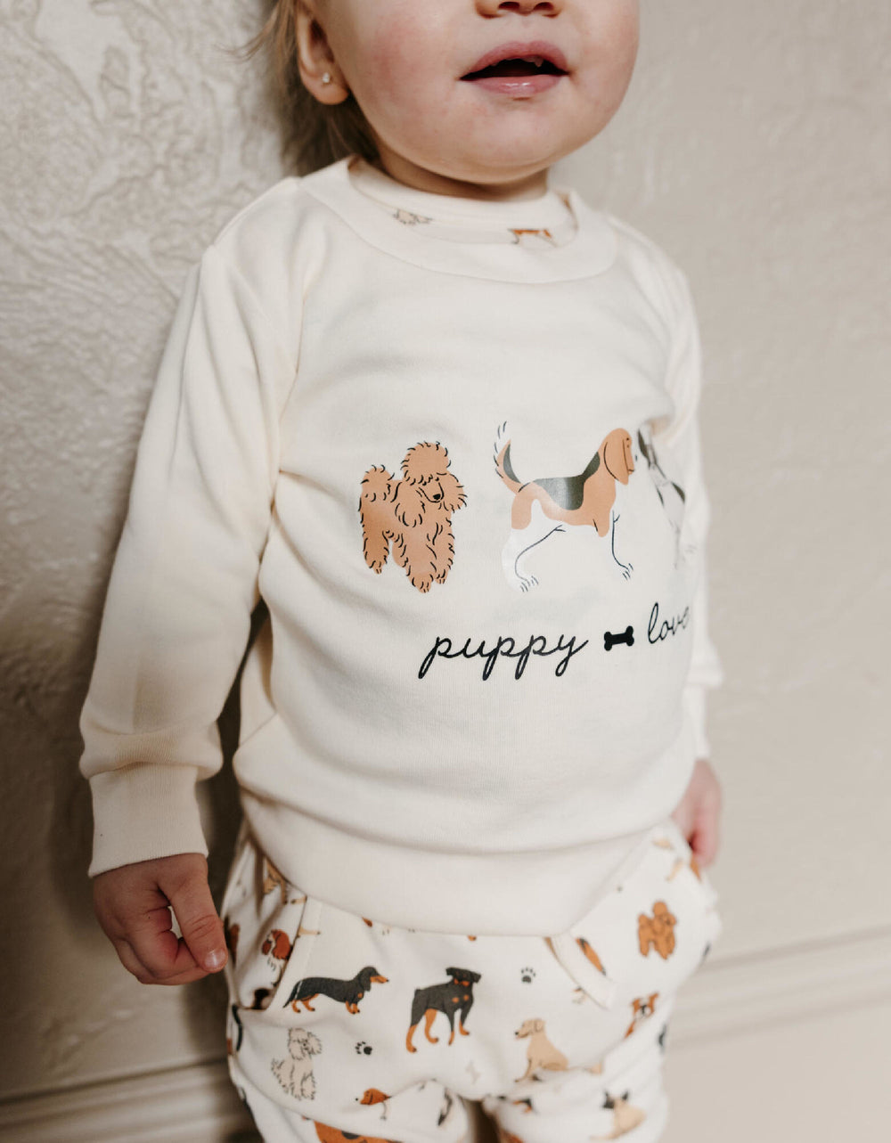 Child wearing Organic Sweatshirt & Jogger Set in Puppy Love.