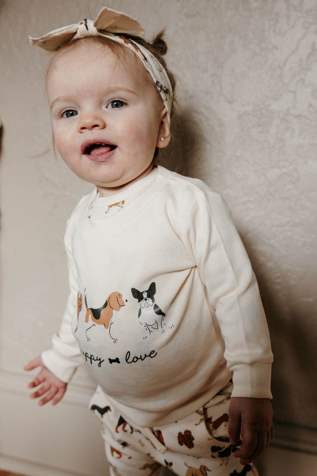 Child wearing Organic Sweatshirt & Jogger Set in Puppy Love.