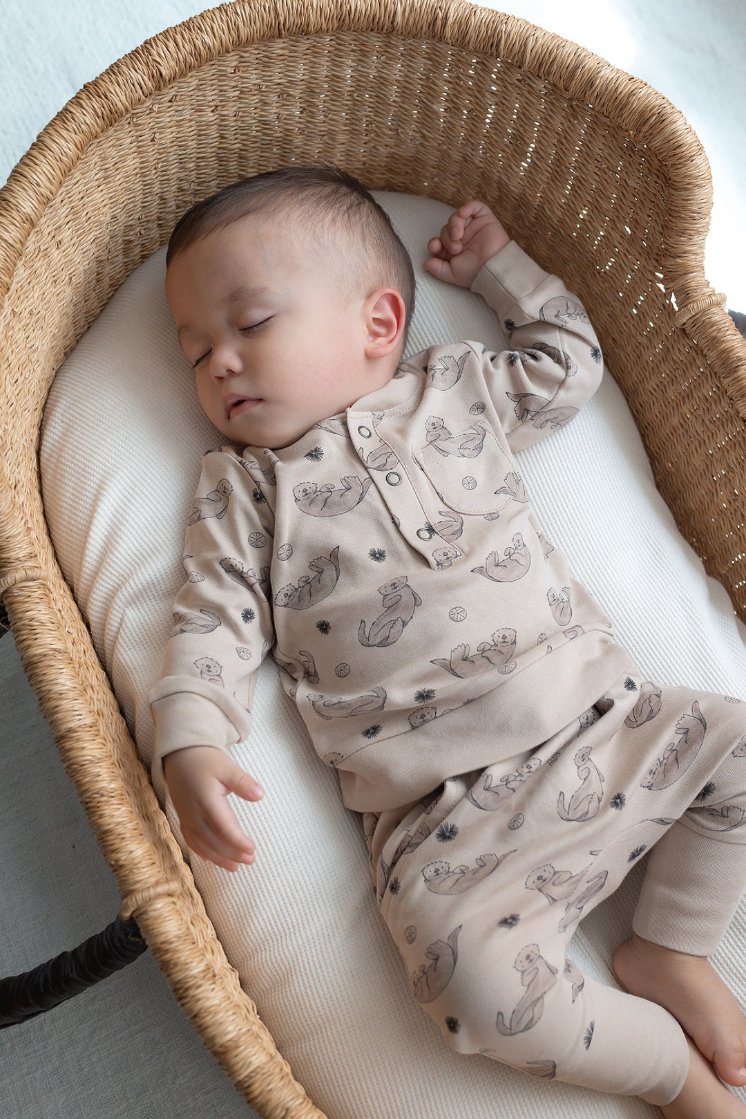 Child wearing Organic Henley Sweatshirt & Jogger Set in Sea Otter.