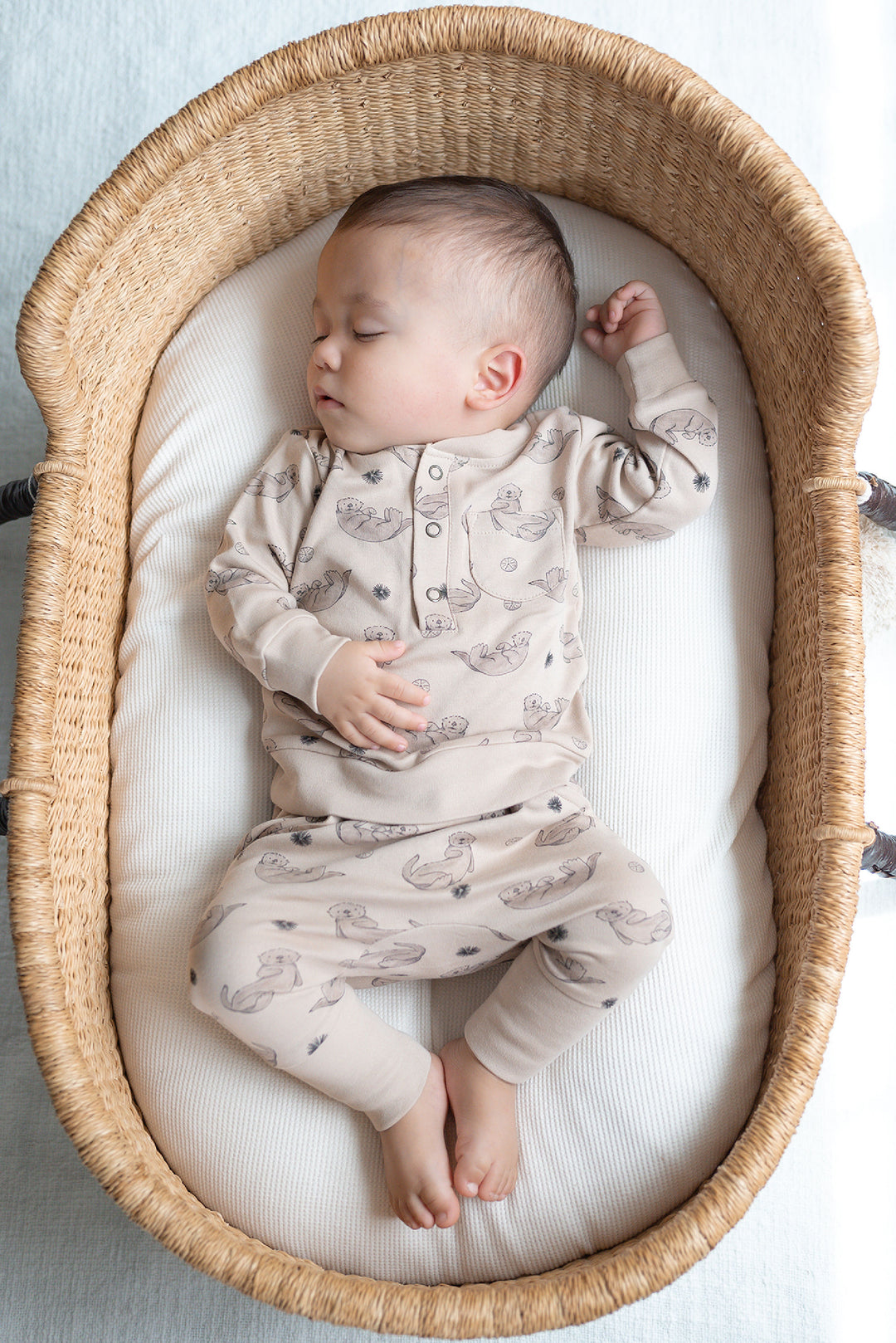 Child wearing Organic Henley Sweatshirt & Jogger Set in Sea Otter.