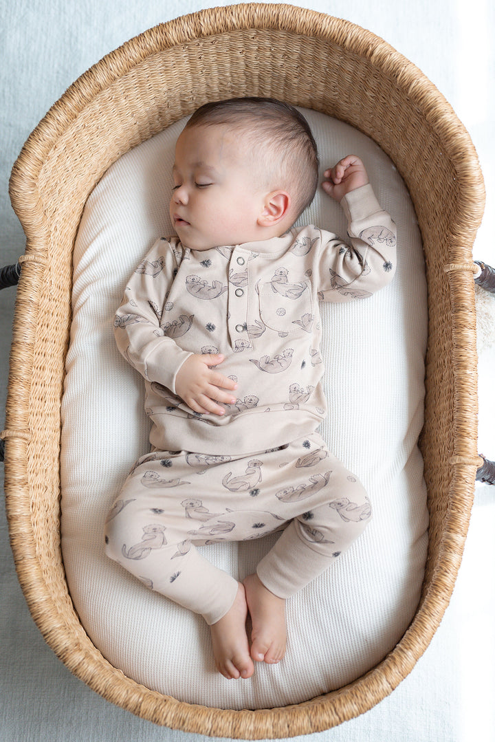 Child wearing Organic Henley Sweatshirt & Jogger Set in Sea Otter.