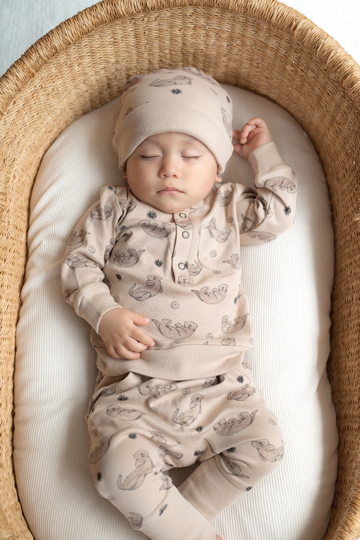 Child wearing Organic Henley Sweatshirt & Jogger Set in Sea Otter.