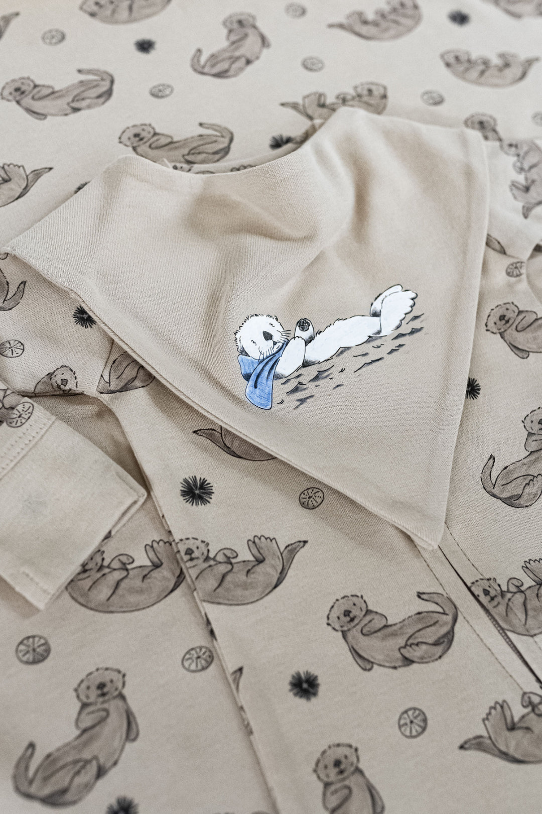 Child wearing Organic Bandana Bib, 2-Pack in Sea Otter.
