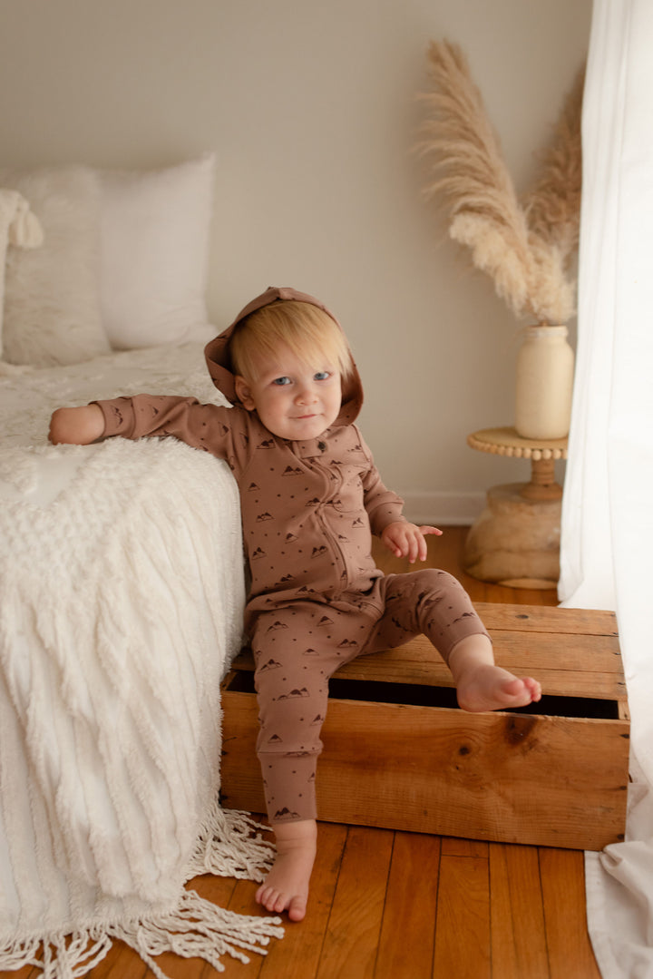 Child wearing Organic Zipper Romper in Latte Mountain.