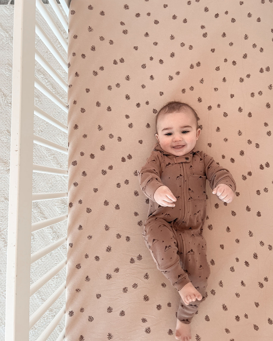 Child wearing Organic Zipper Romper in Latte Mountain.