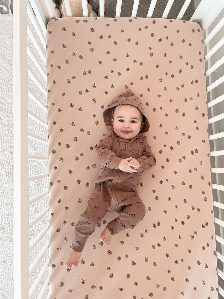 Child wearing Organic Zipper Romper in Latte Mountain.