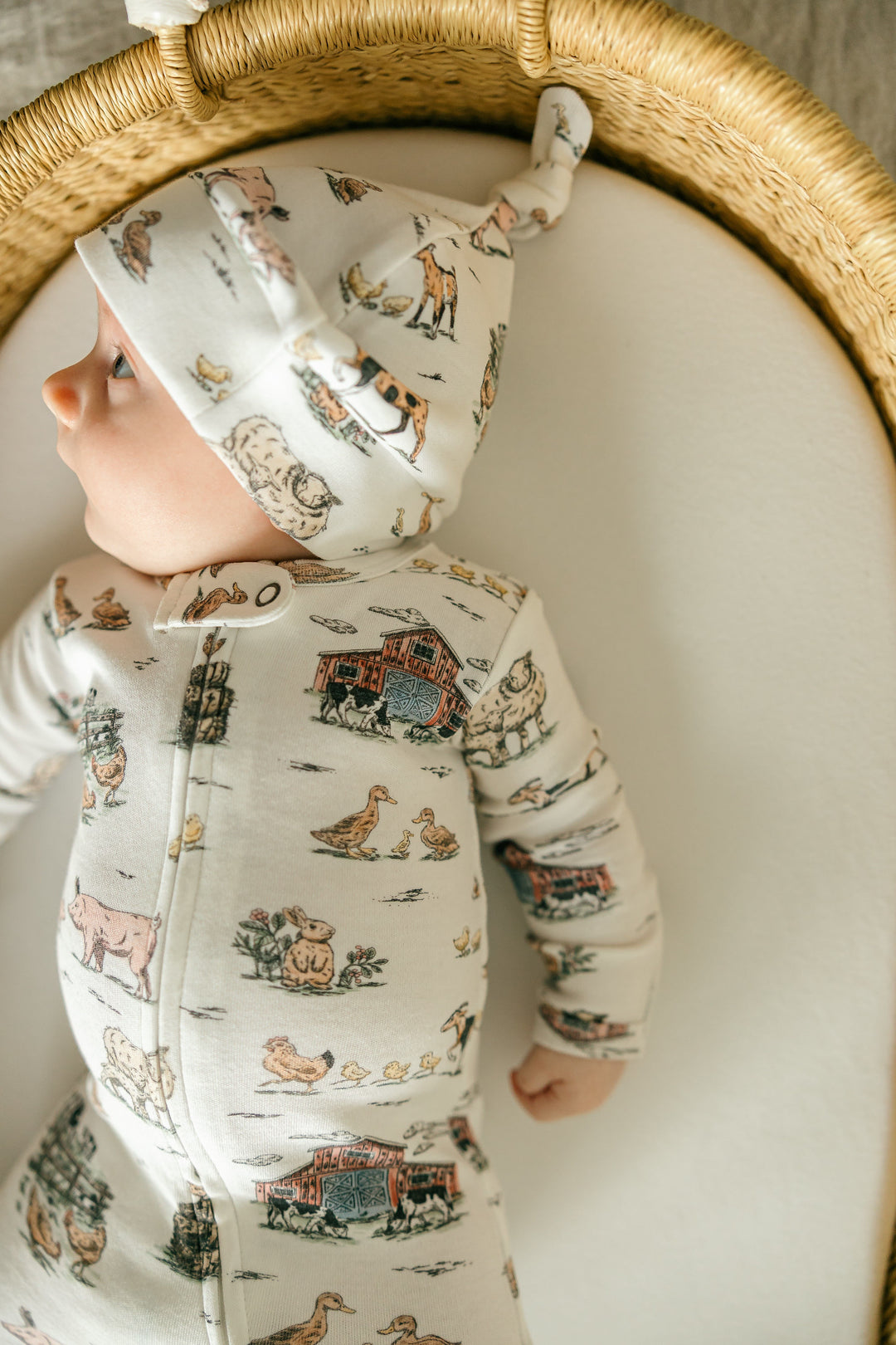 Child wearing Organic Knotted Hat in Farm Friends.