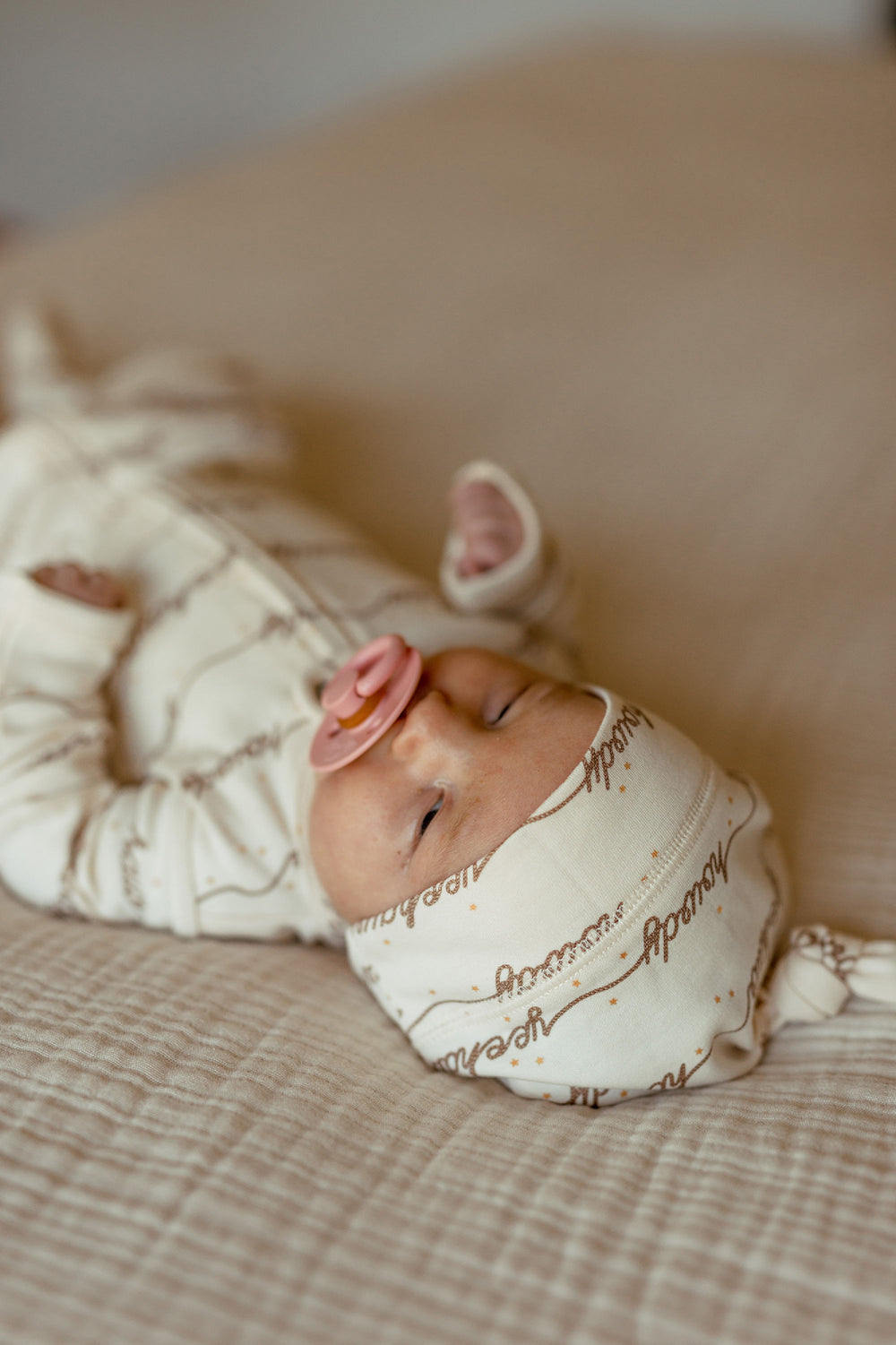 Child wearing Organic Knotted Hat in Howdy.