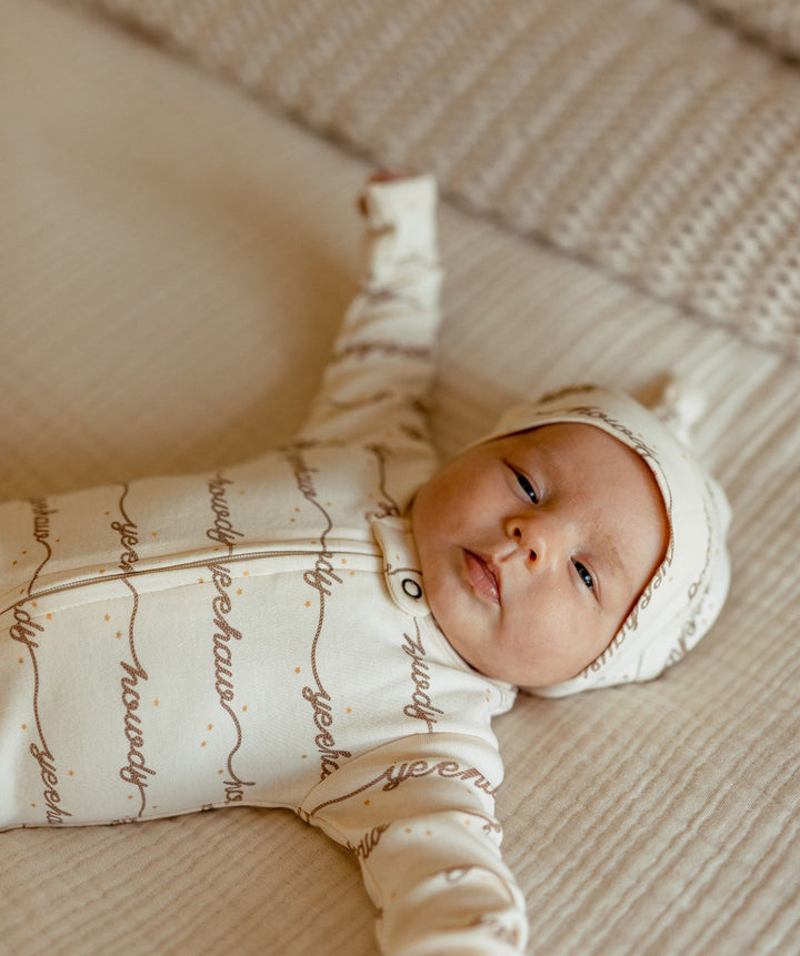 Child wearing Organic Knotted Hat in Howdy.