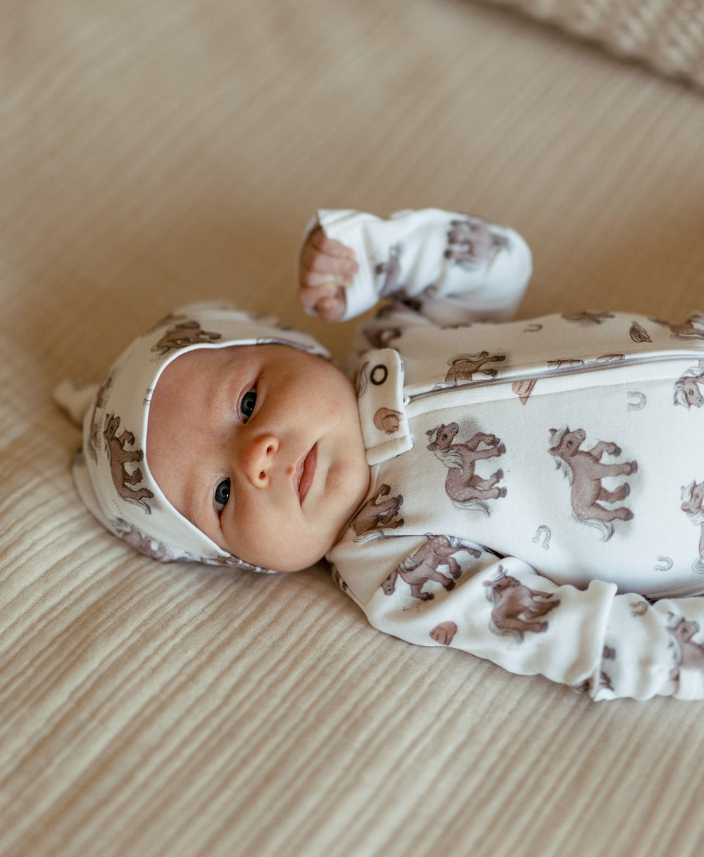 Child wearing Organic Knotted Hat in Little Lasso.