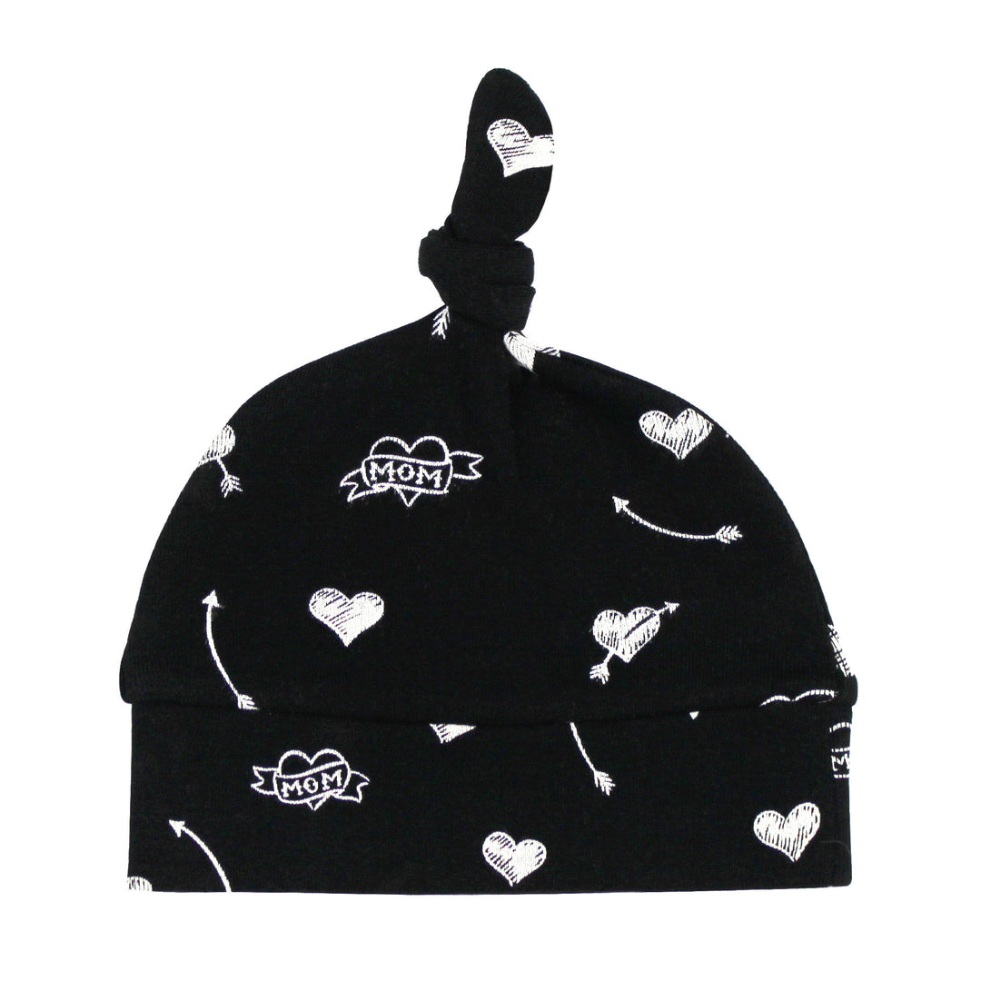 Black baby hat with white patterns on a white background