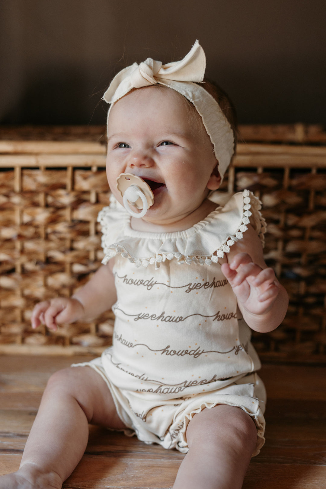 Child wearing Organic Bubble Romper in Howdy.